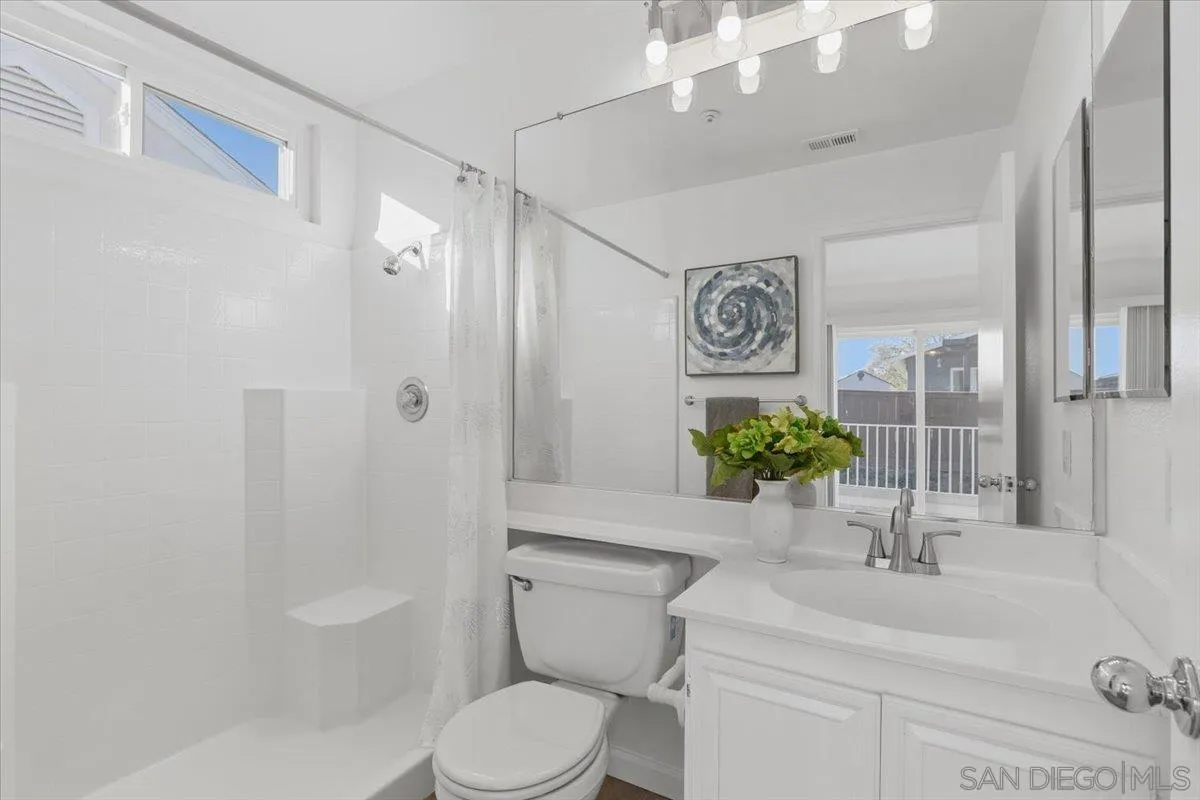 8973 Arlingdale Way Spring Valley, CA 91977 - Photo 8 of 24 a bathroom with a sink a toilet and shower