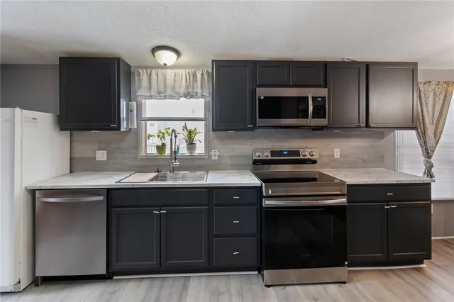 $79,900 | 6377 Whispering Woods Drive, Unit 10, Williamson, NY 14589