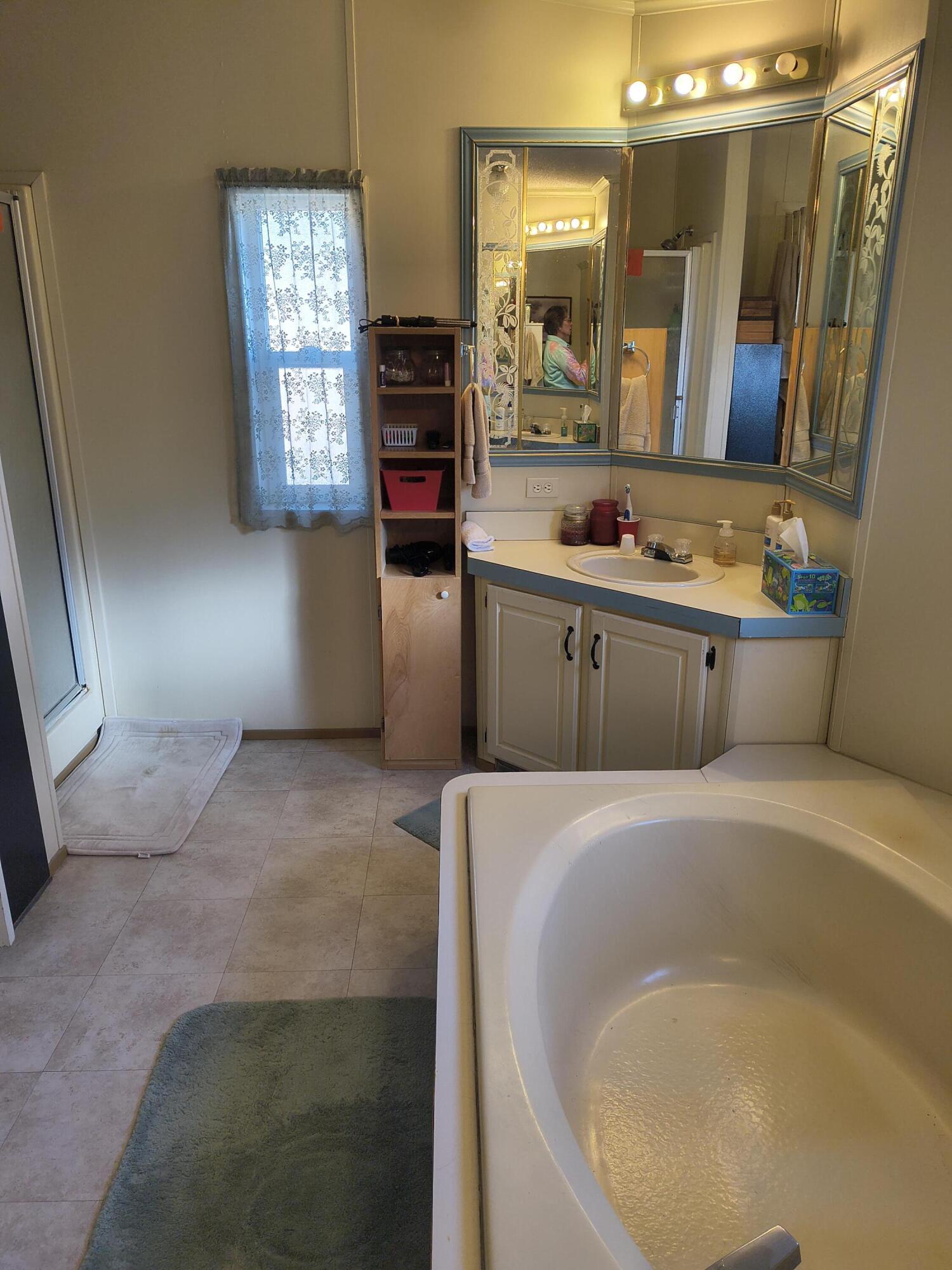 235 North Roosevelt Street Merrill, OR 97633 - Photo 27 of 27 a spacious bathroom with sink and mirror