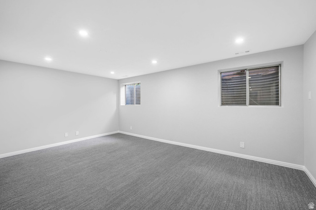 8965 Quail Run Drive Sandy, UT 84093 - Photo 24 of 56 Empty room featuring recessed lighting and dark carpet