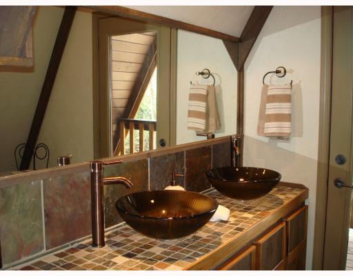1590 County Line Road Champion, PA 15622 - Photo 11 of 18 Master Bath/Spa. Incredible Master Bath w/ Glass Door to 12x4 Deck. Unique Double Glass Bowl Sinks w/ Slate Countertops, Heated Slate Floors & Slate Shower Stall featuring Teak Shower Panel w/ Body Jets. New Plumbing Fixtures & Toilets.