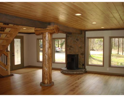 1590 County Line Road Champion, PA 15622 - Photo 3 of 18 Den/Family/Great Room. New Harmon Pellet Stove, Hearth and Beautiful Stonework is also in Great Room in Front along Sun-filled Wall of 4 Windows. New Lead Glass Frosted Door to 9x7 Front Patio. New Wood Interior Doors thru-out New Chimney Pointing, New Chimney Caps and Damper.