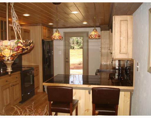 1590 County Line Road Champion, PA 15622 - Photo 5 of 18 Kitchen. Convenient Granite Tile Breakfast Bar with Beautiful Overhead Lighting, matches Dining Area Chandelier. New Light Fixtures thru-out. All New Electrical Switches & Outlets featuring 150 AMP Service. New Armstrong Furnace & A/C and Ductwork.