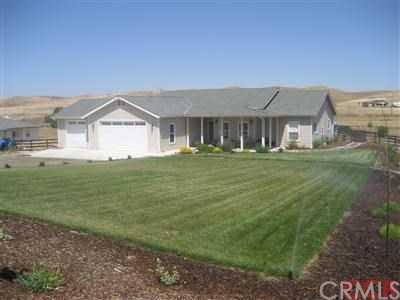 Nicely landscaped front with auto sprinkler system.