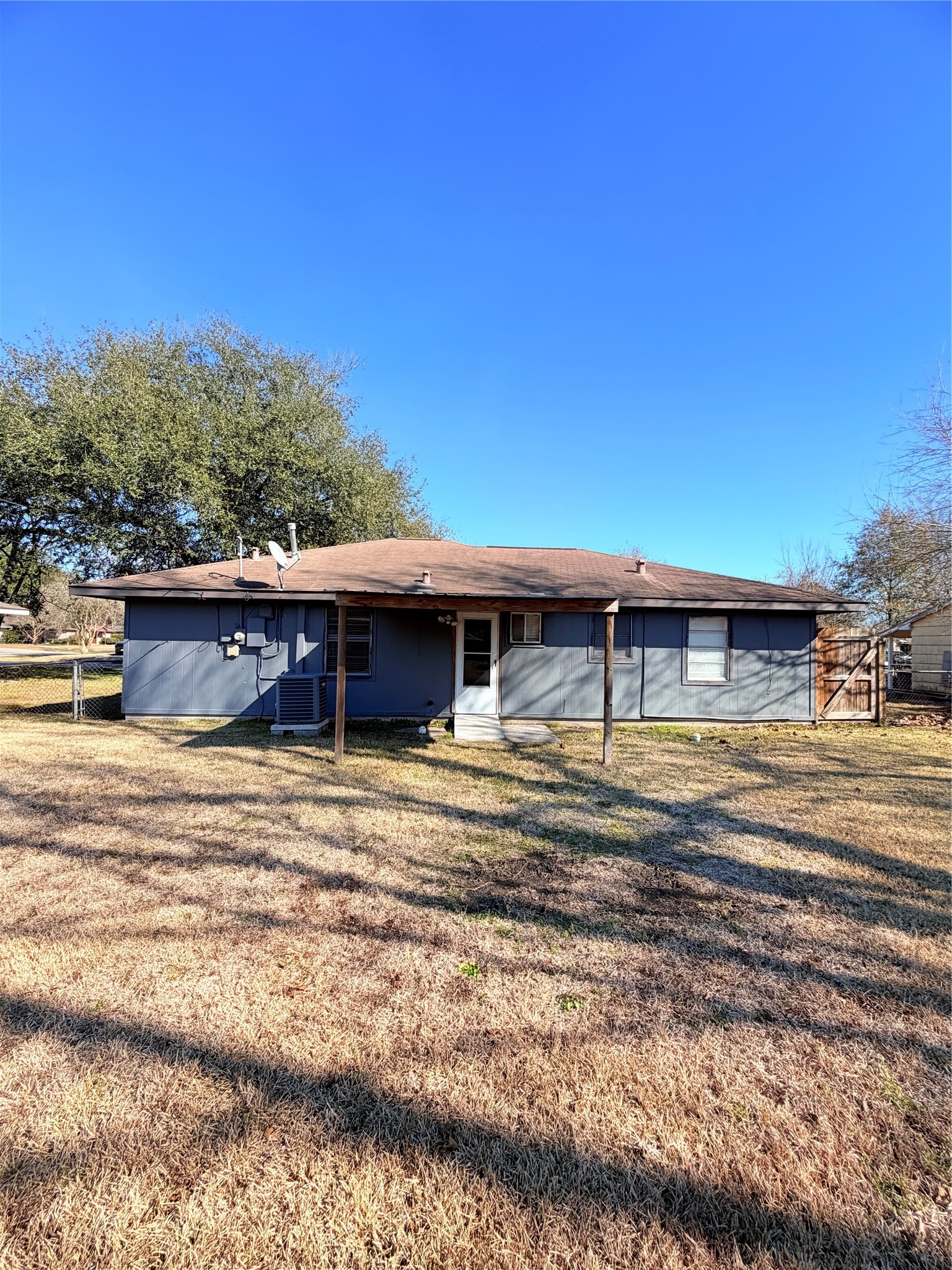 207 Inwood Lane Highlands, TX 77562 - Photo 15 of 20 a view of a house with a swimming pool