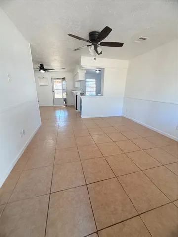a view of a livingroom with a furniture and a ceiling fan
