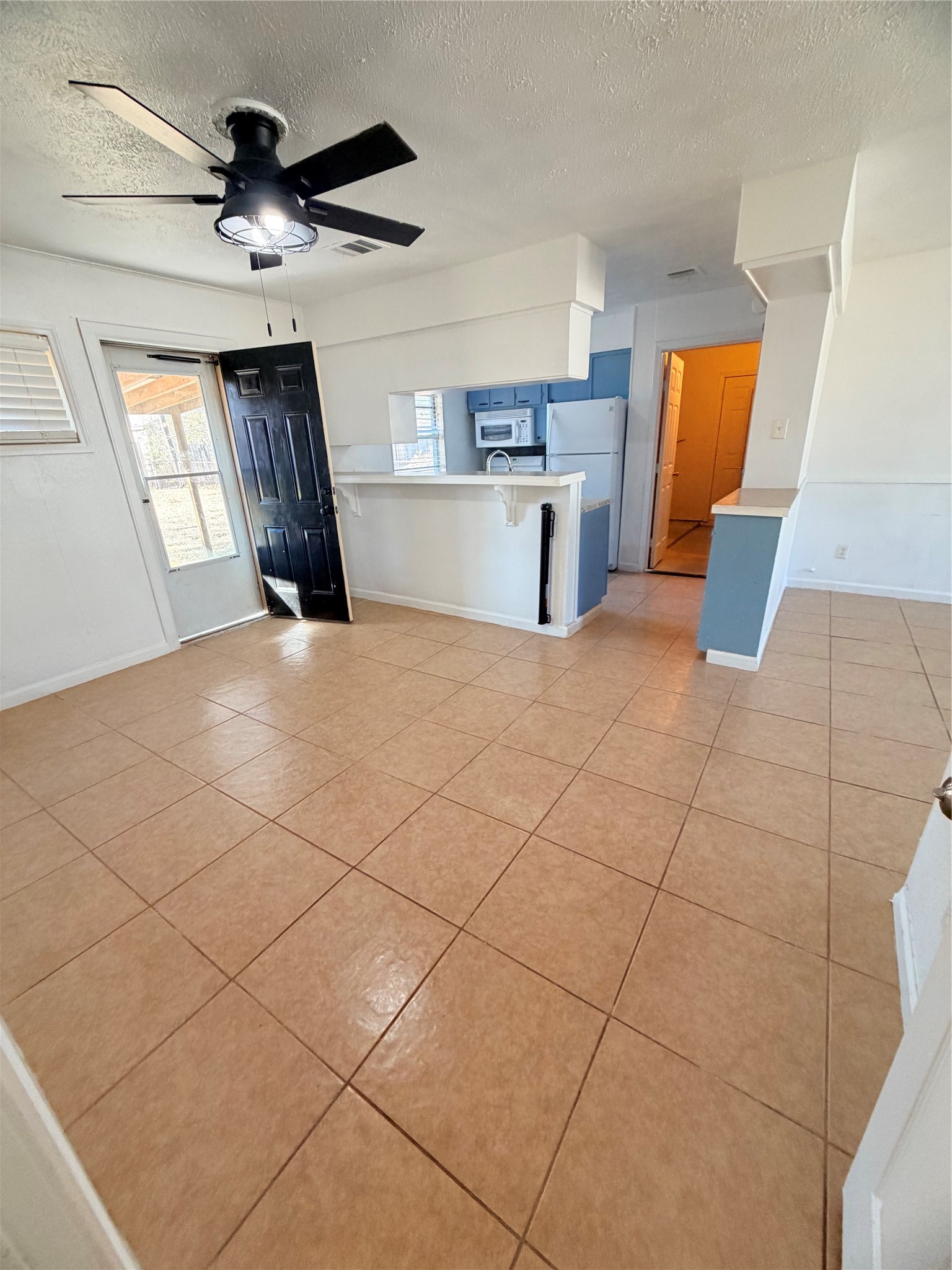 207 Inwood Lane Highlands, TX 77562 - Photo 8 of 20 a view of empty room with wooden floor and window