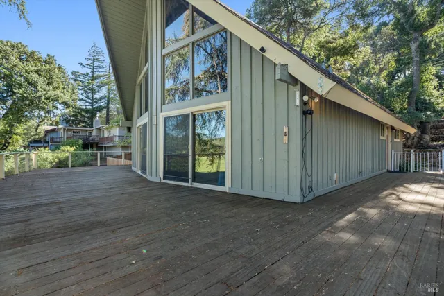 a view of a house with a yard porch and sitting area
