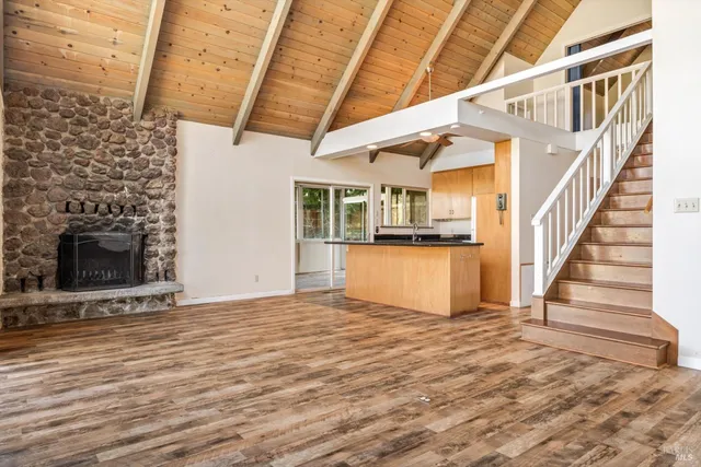 a view of entryway and kitchen with a window