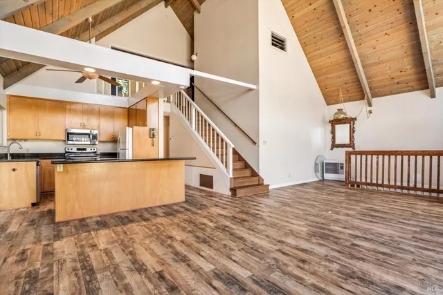 a kitchen with a stove a sink and a refrigerator
