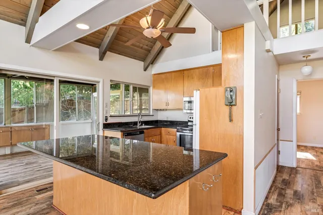 a view of an entryway with wooden floor