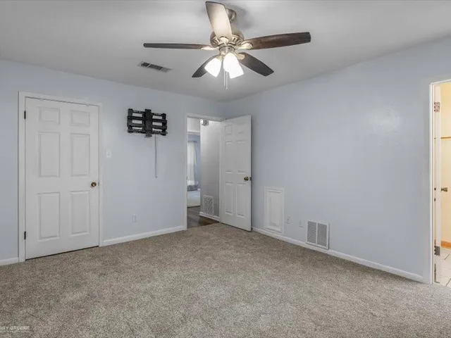 a close view of sink cabinets and utility room