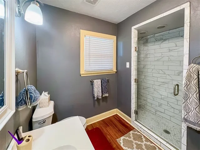 a bedroom with a bed and a mirror