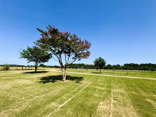 a view of a swimming pool with an outdoor space and seating area