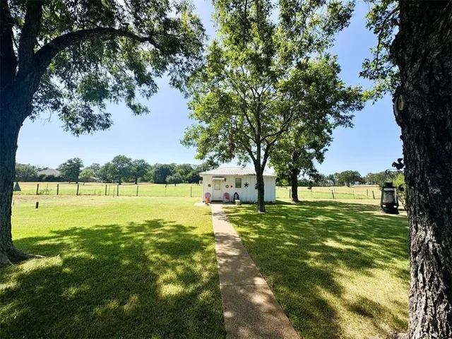 a view of a lake with a big yard