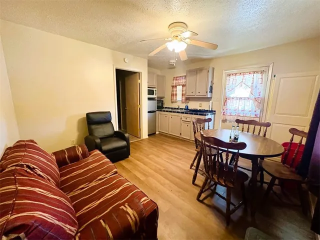 a living room with furniture fireplace and a table