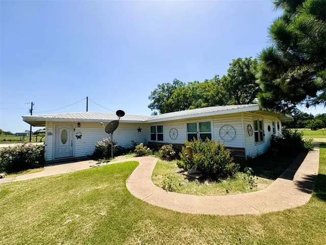 a view of a house with a yard balcony