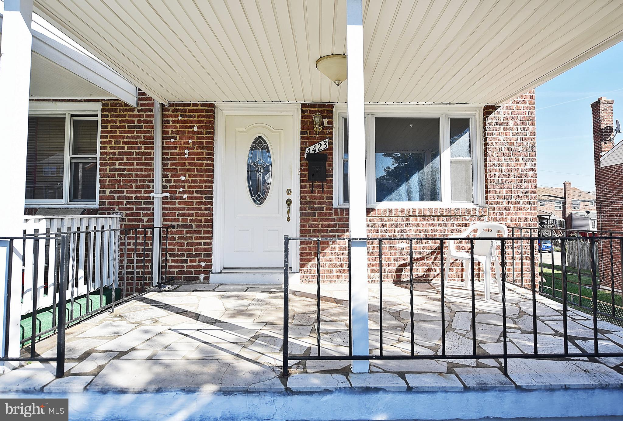 4423 Fenor Road Baltimore, MD 21227 - Photo 3 of 28 a view of a porch with a table and chairs