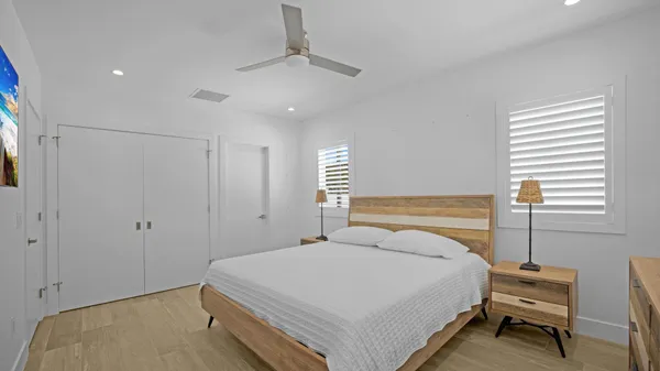 a bedroom with a bed and window