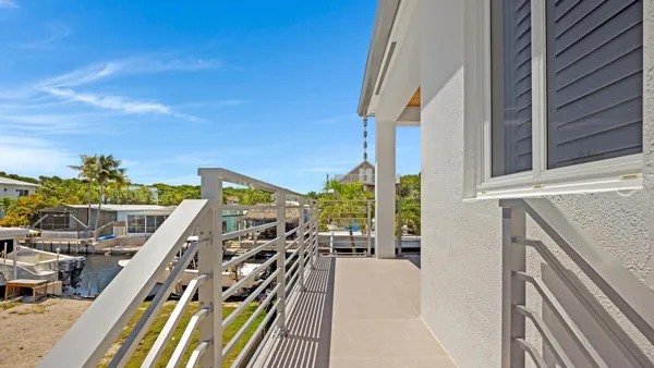a view of an empty room with furniture