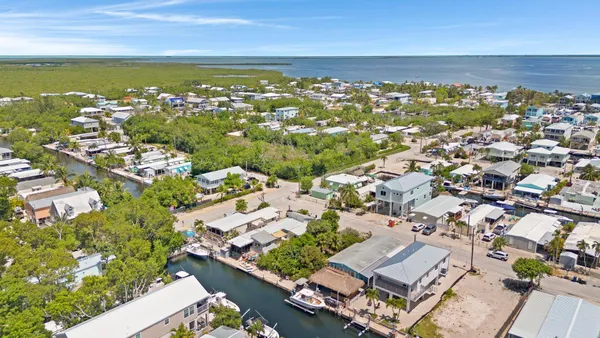 an aerial view of residential building and parking space