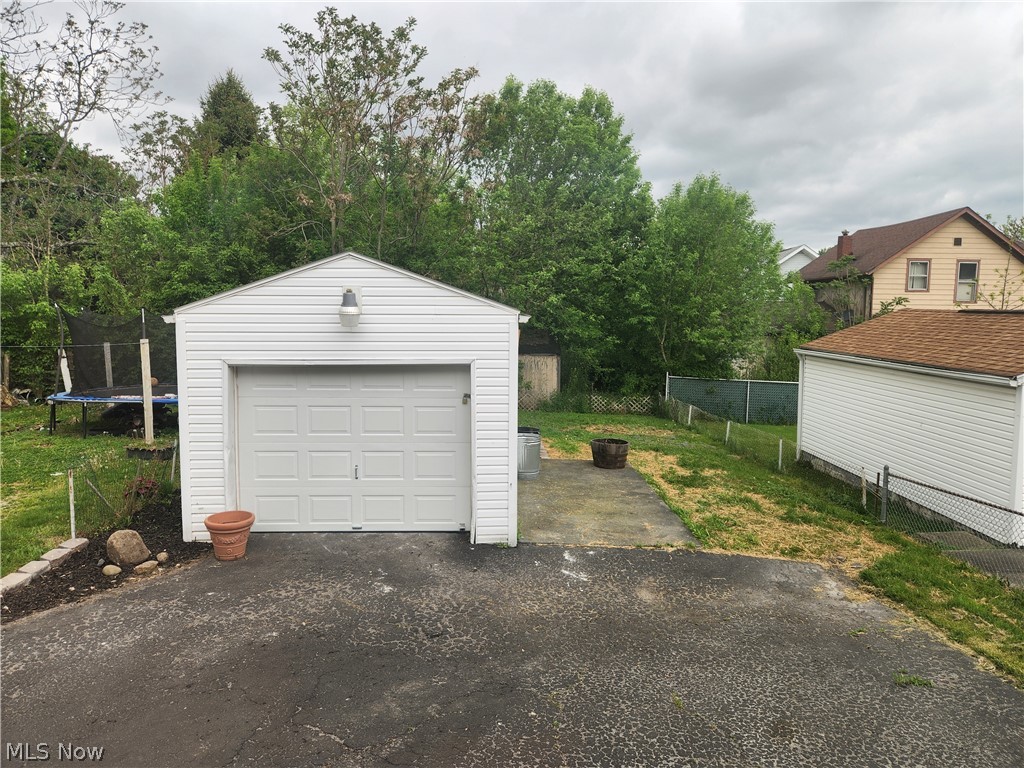 698 Patterson Avenue Akron, OH 44310 - Photo 20 of 20 1 car garage and view of the yard