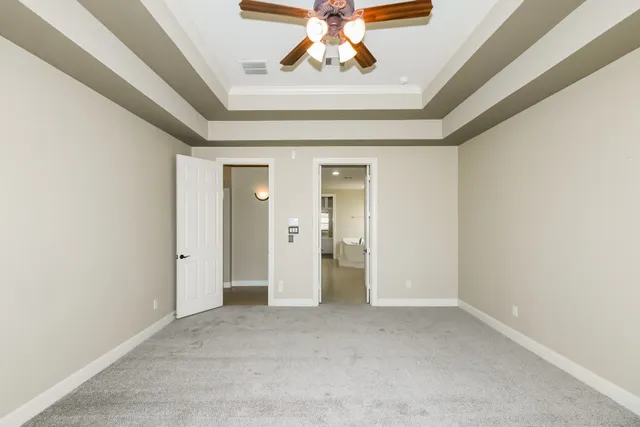 a large bathroom with a large tub sink shower and mirror