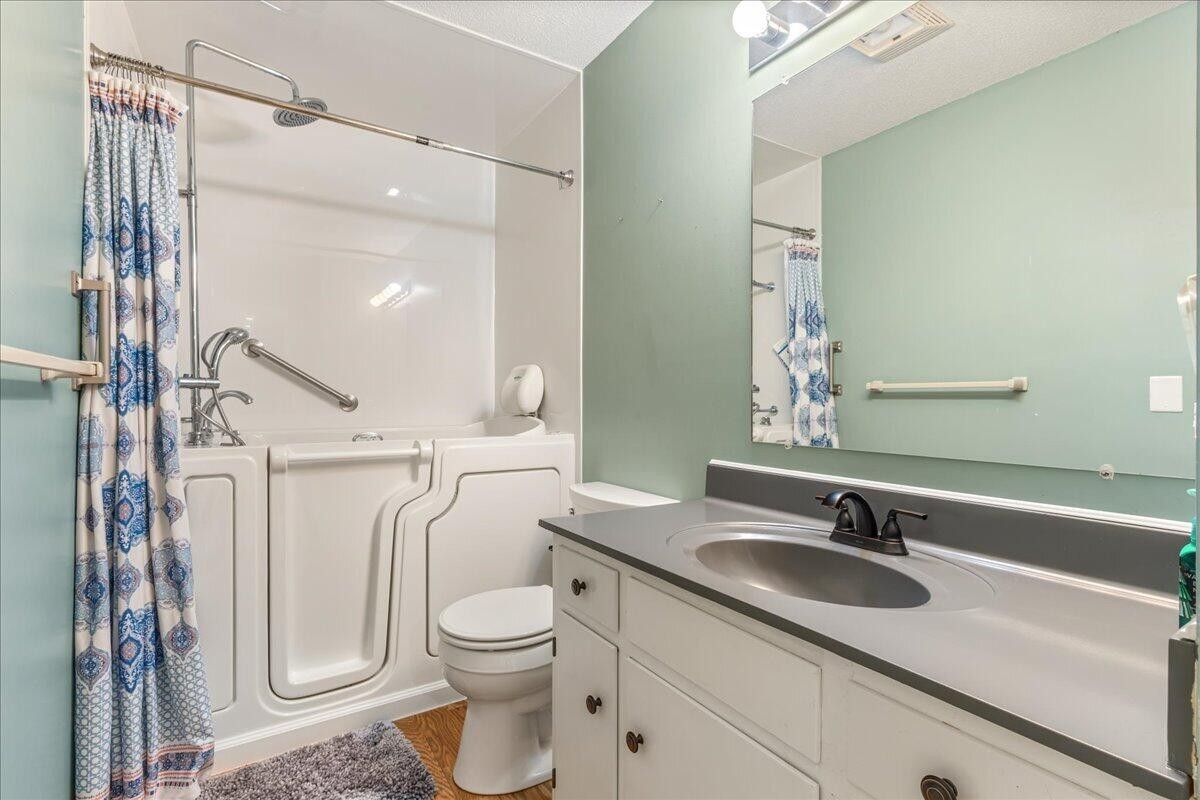 2522 Cindy Street Athens, TN 37303 - Photo 25 of 36 a bathroom with a granite countertop sink a toilet and a mirror