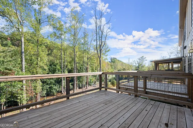 a view of a patio with chairs and plants