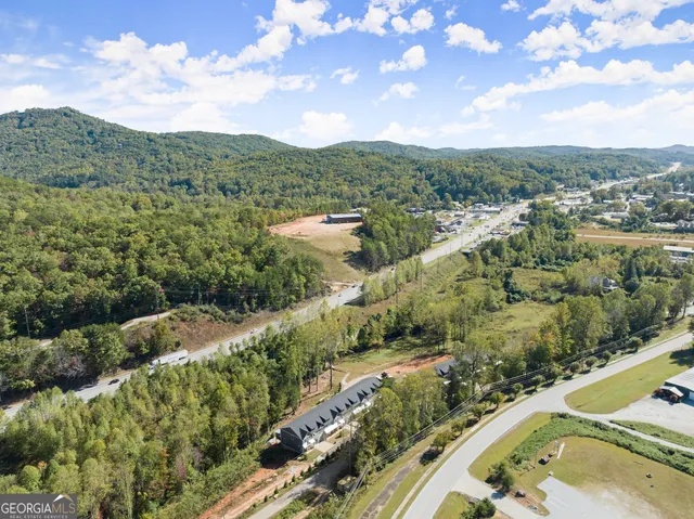 an aerial view of multiple house with yard