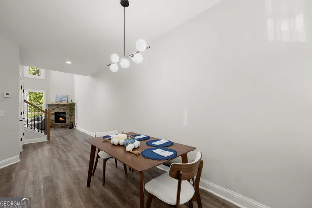 a view of a workspace with furniture and wooden floor