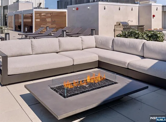 a view of living room with furniture and a rug