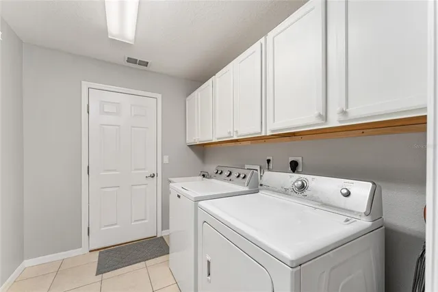 a bedroom with a bed and a ceiling fan