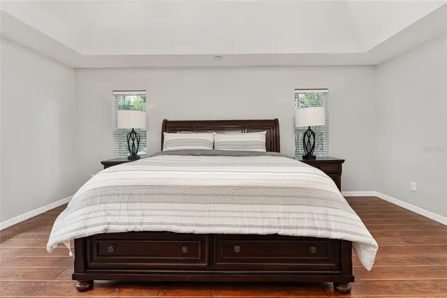 a bedroom with a bed and a dresser