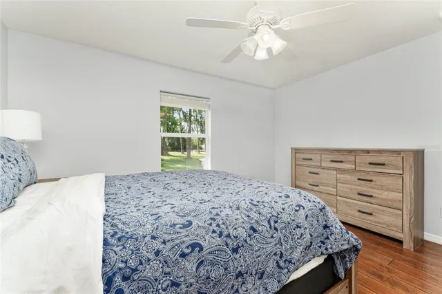 a view of a house with a backyard and a patio