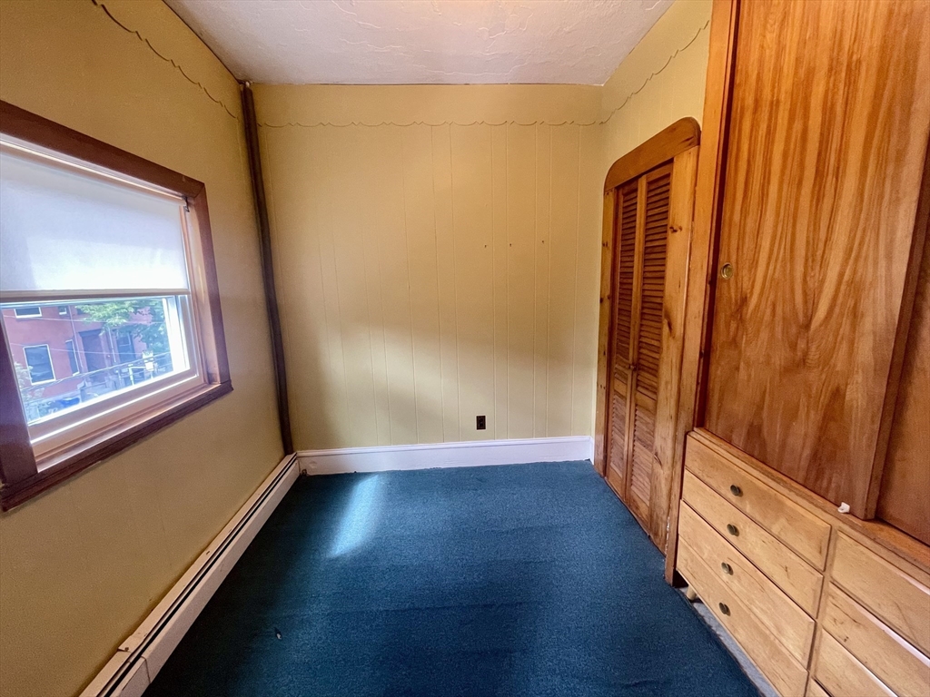 136 Saratoga Street, Unit 2 Boston, MA 02128 - Photo 7 of 19 a view of a room with wooden floor and stairs