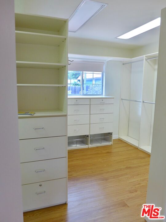 3124 Veteran Avenue Los Angeles, CA 90034 - Photo 14 of 23 a view of walk in closet with empty racks