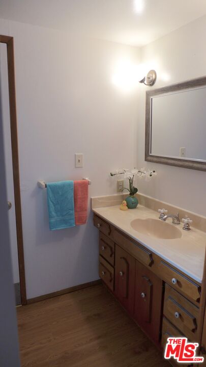 3124 Veteran Avenue Los Angeles, CA 90034 - Photo 16 of 23 a bathroom with a sink and a mirror