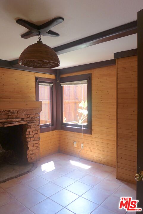 3124 Veteran Avenue Los Angeles, CA 90034 - Photo 22 of 23 a view of an empty room with a fireplace and a window