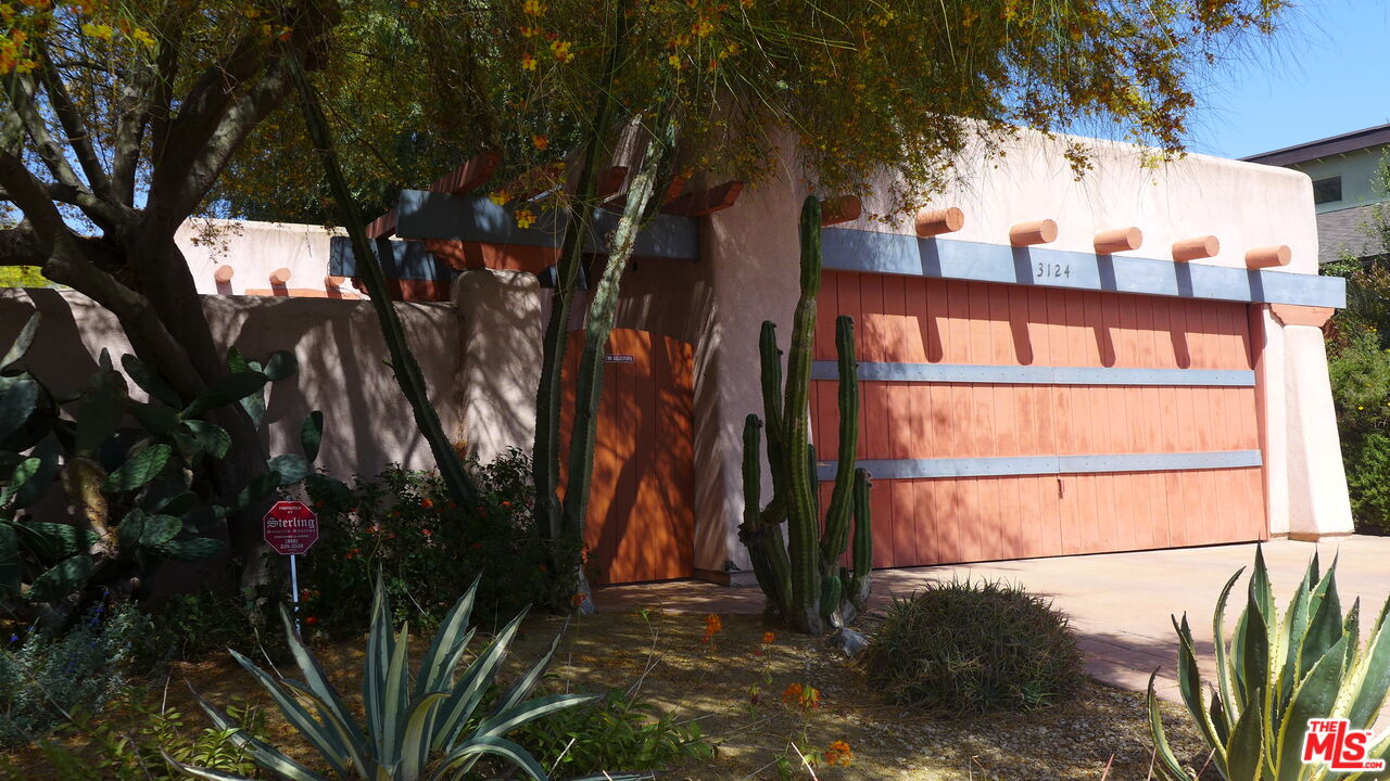3124 Veteran Avenue Los Angeles, CA 90034 - Photo 5 of 23 a view of a house with a tree