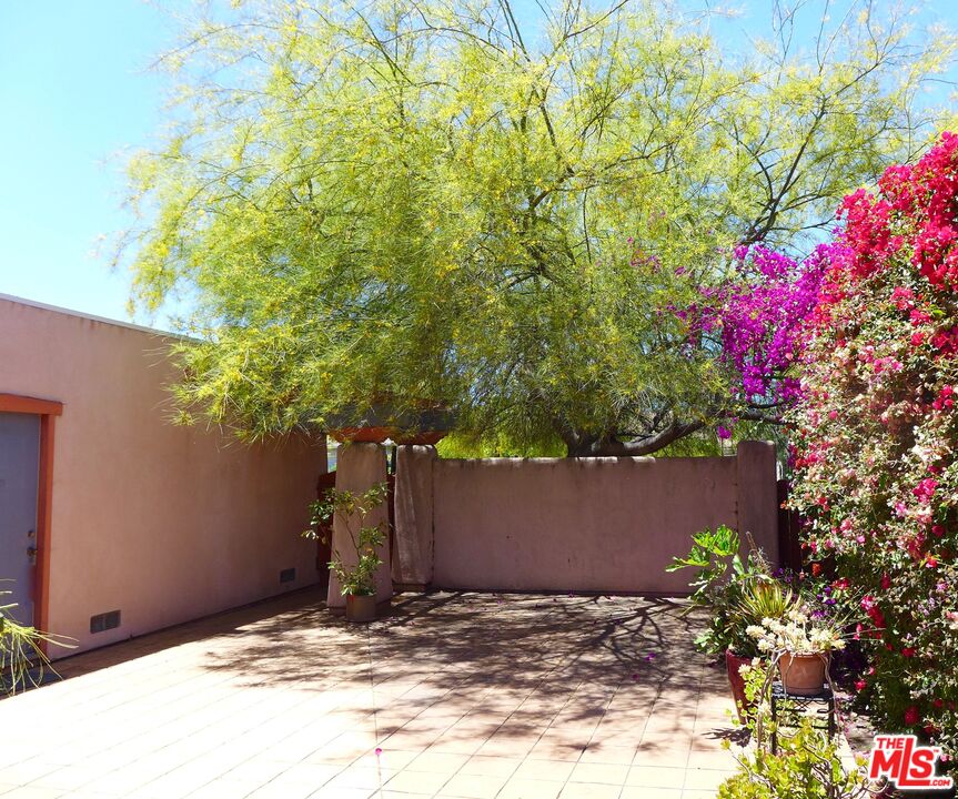 3124 Veteran Avenue Los Angeles, CA 90034 - Photo 9 of 23 a view of a house with a flower garden