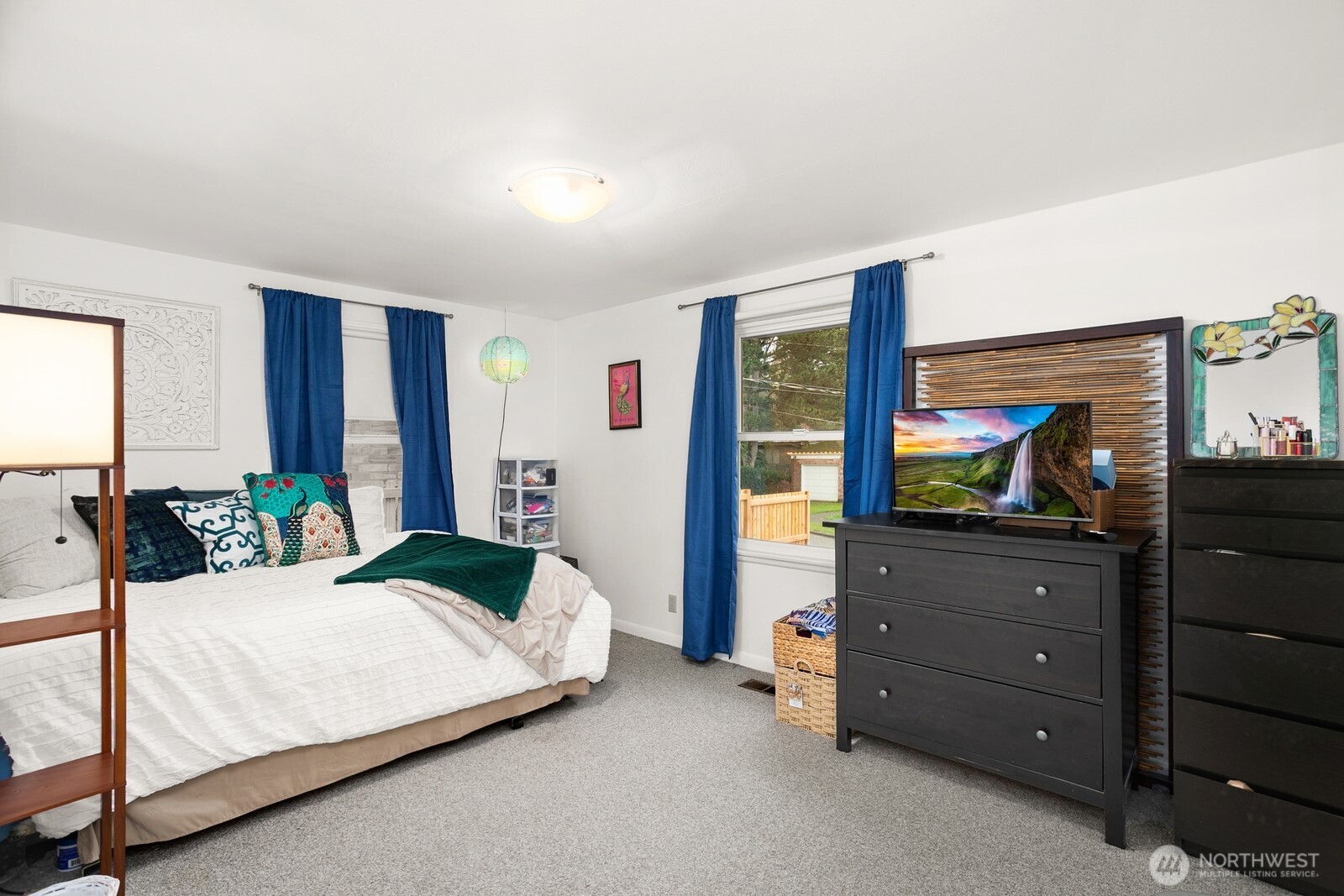 3542 43rd Avenue West Seattle, WA 98199 - Photo 16 of 39 a bedroom with a bed and with television