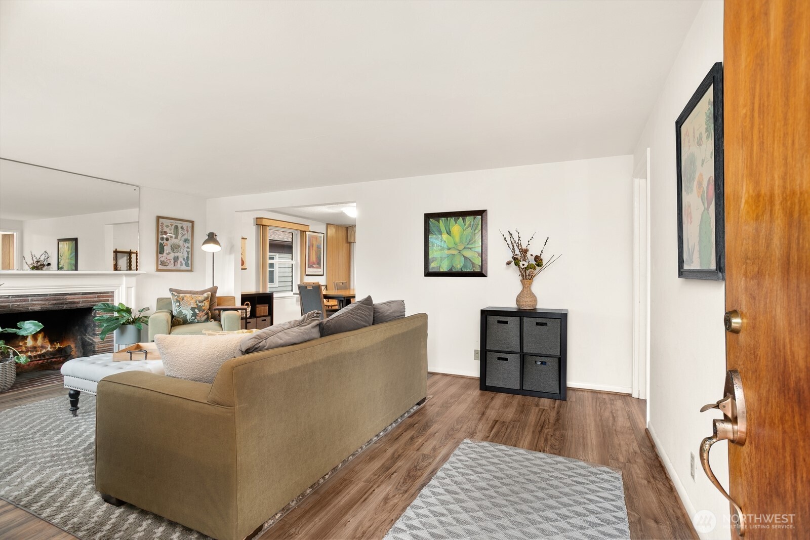 3542 43rd Avenue West Seattle, WA 98199 - Photo 2 of 39 a living room with furniture and a wooden floor