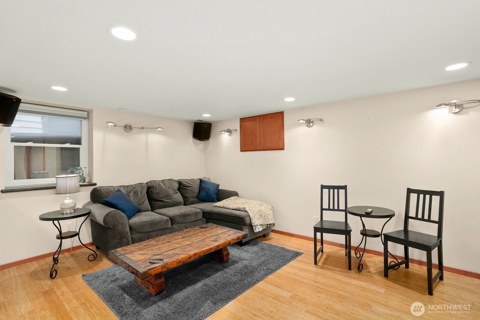 3542 43rd Avenue West Seattle, WA 98199 - Photo 22 of 39 a living room with furniture and a wooden floor