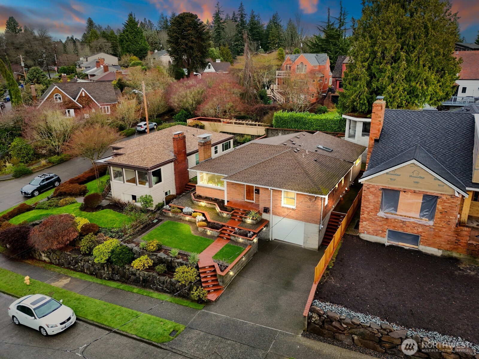 3542 43rd Avenue West Seattle, WA 98199 - Photo 35 of 39 an aerial view of a house with a garden and lake view