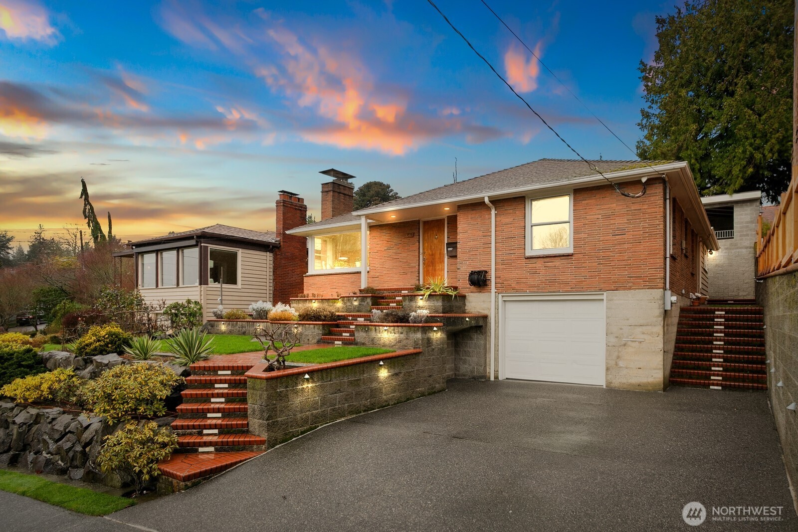 3542 43rd Avenue West Seattle, WA 98199 - Photo 36 of 39 a front view of a house with a garden