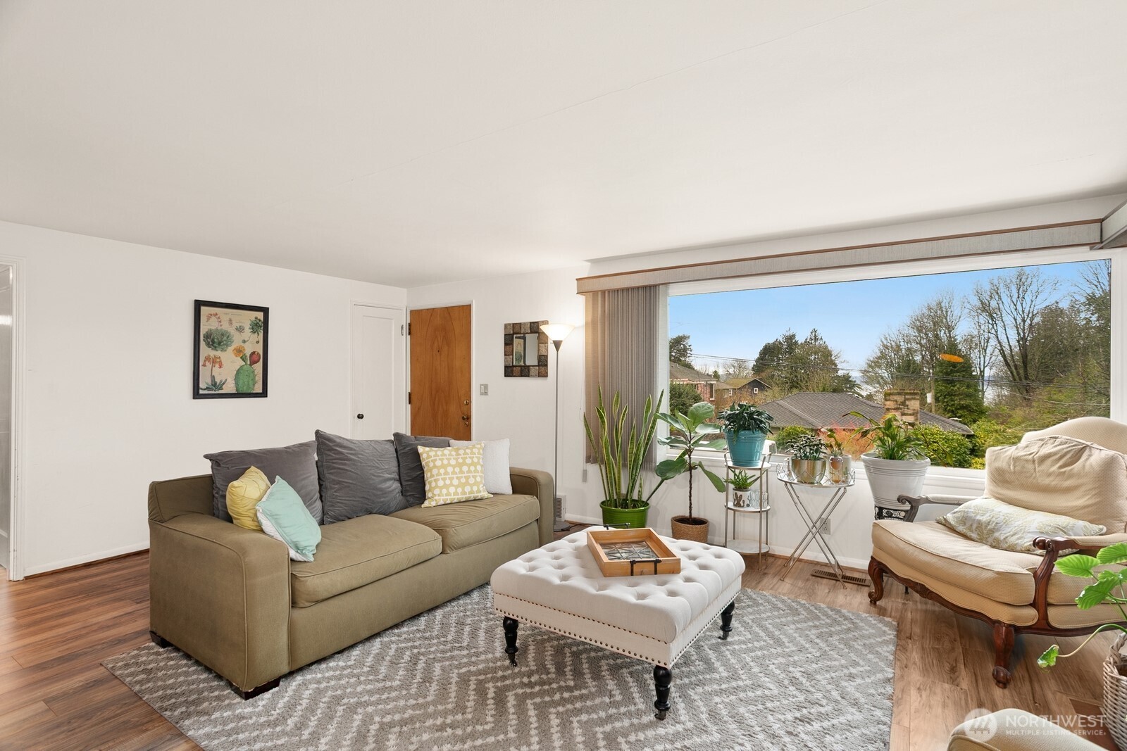 3542 43rd Avenue West Seattle, WA 98199 - Photo 4 of 39 a living room with furniture and a large window