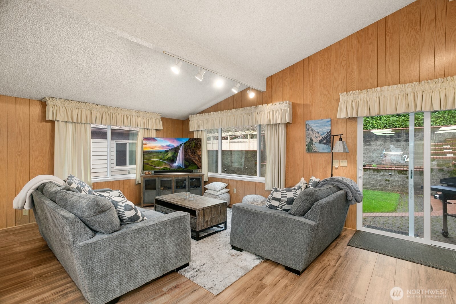 3542 43rd Avenue West Seattle, WA 98199 - Photo 7 of 39 a living room with furniture and a large window