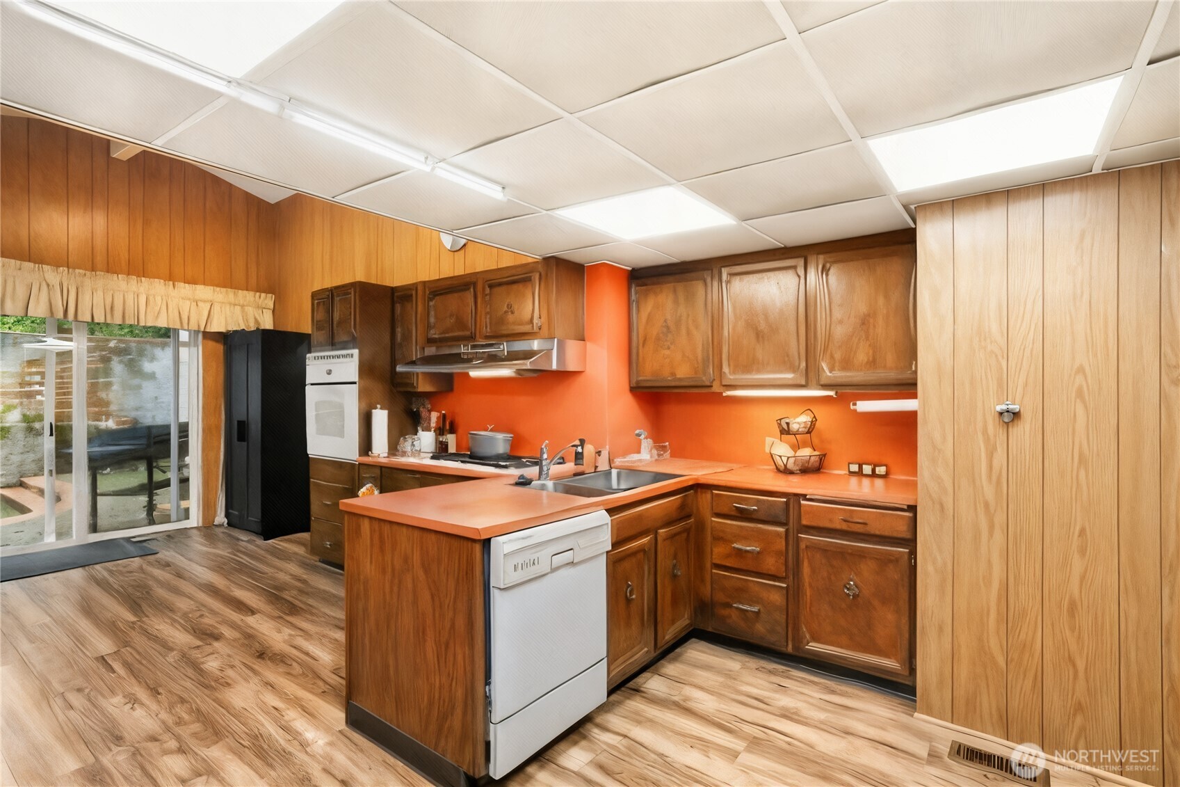3542 43rd Avenue West Seattle, WA 98199 - Photo 8 of 39 a kitchen with stainless steel appliances granite countertop a sink stove and refrigerator