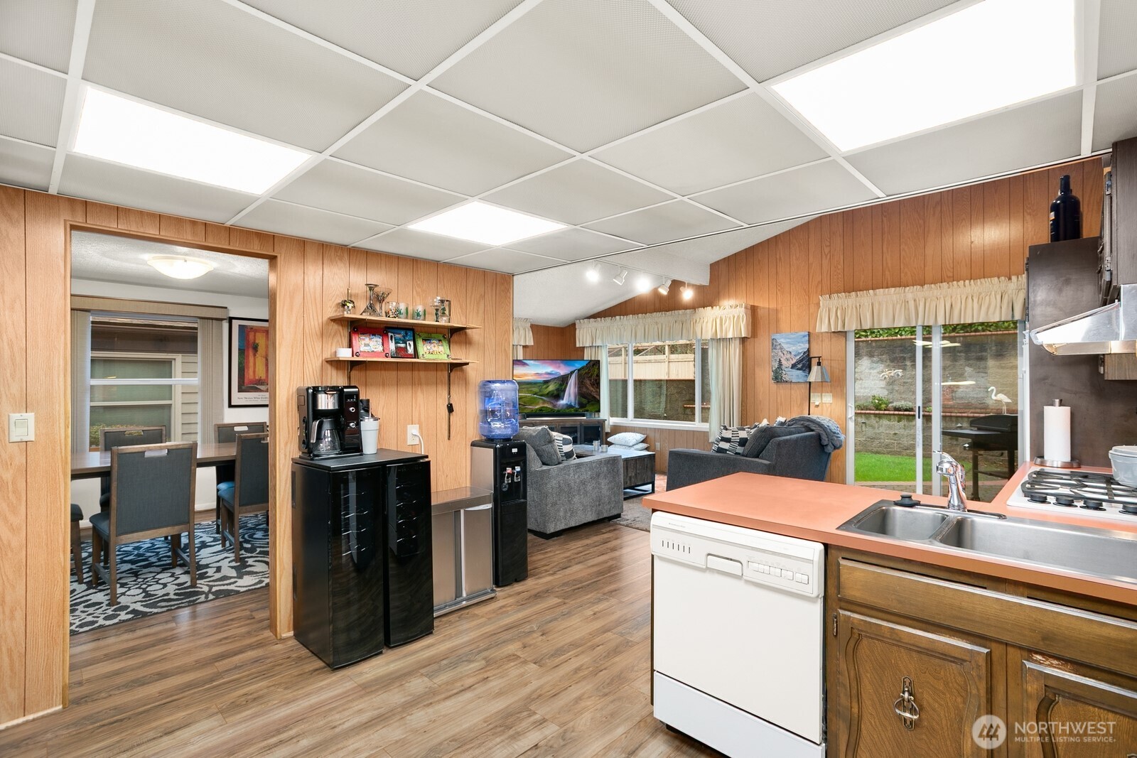 3542 43rd Avenue West Seattle, WA 98199 - Photo 9 of 39 a kitchen that has a lot of cabinets and refrigerator
